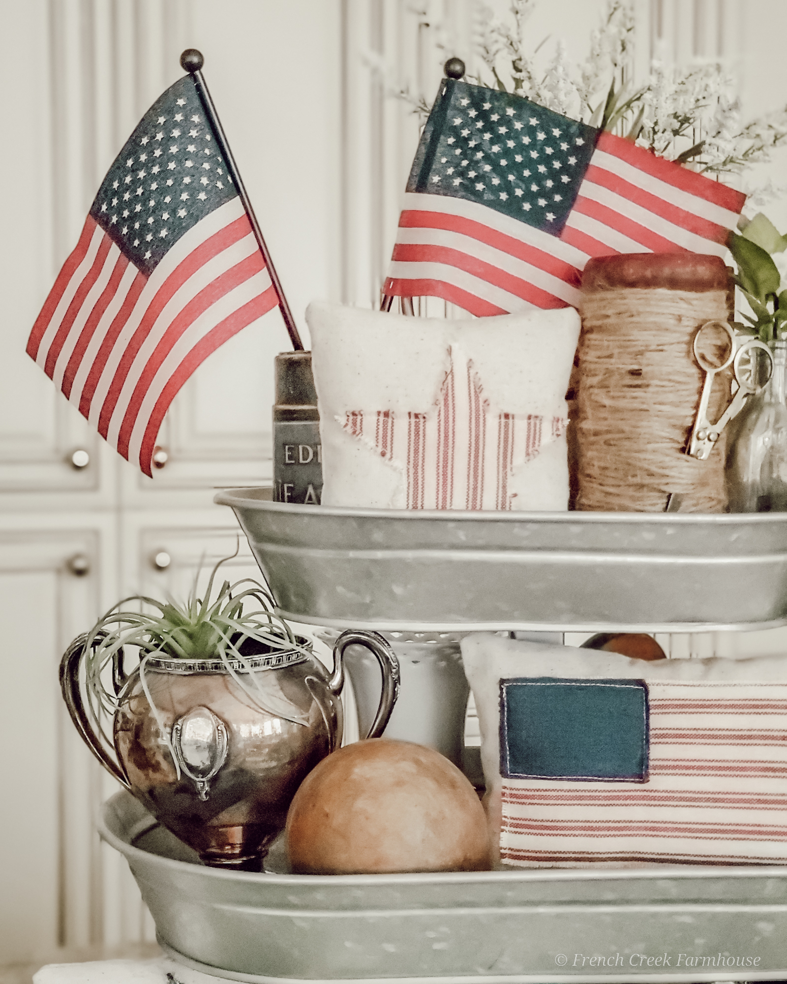 American flags top a tiered tray decorated for 4th of July