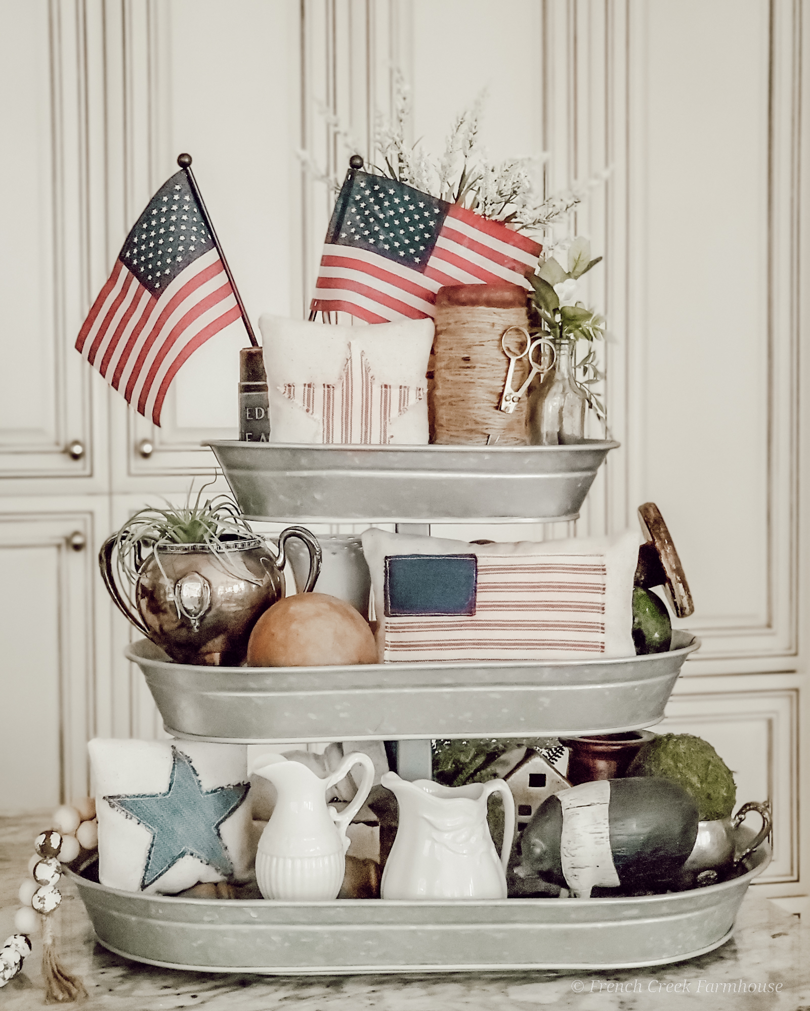 Three-tiered galvanized tray with vintage Americana decor