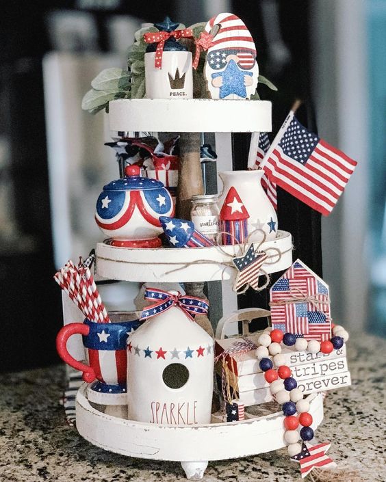 Red white and blue decor on a white 3-tier tray