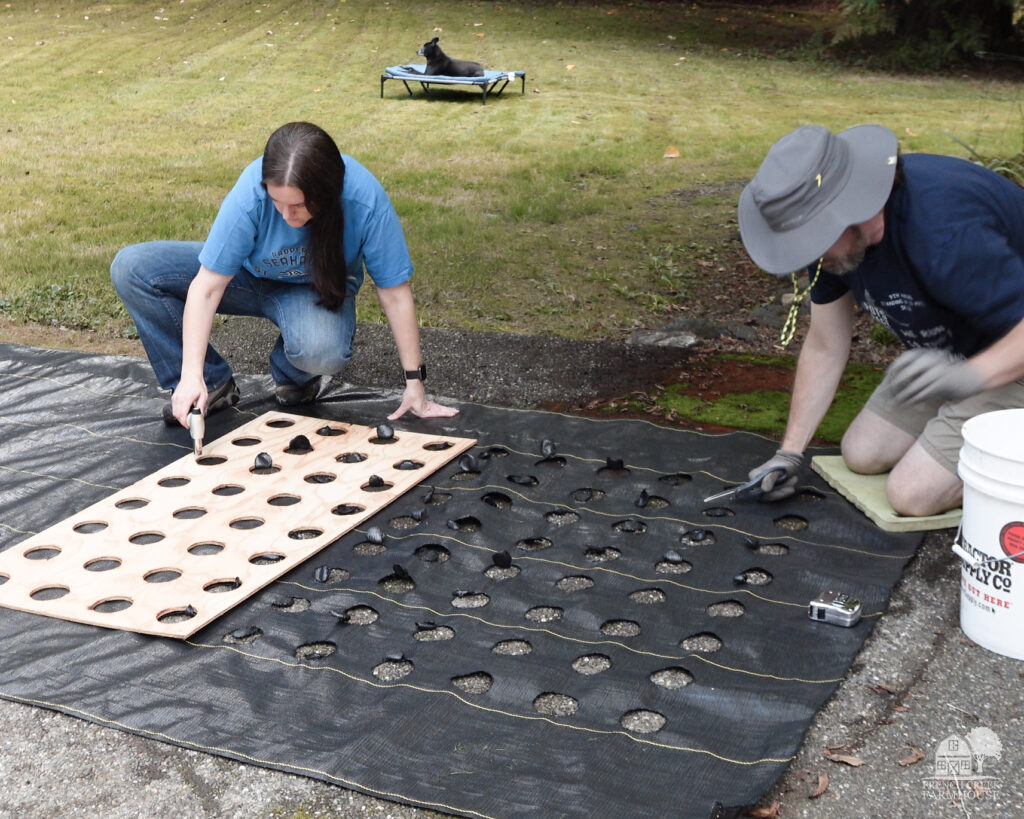 Burning holes in landscape fabric